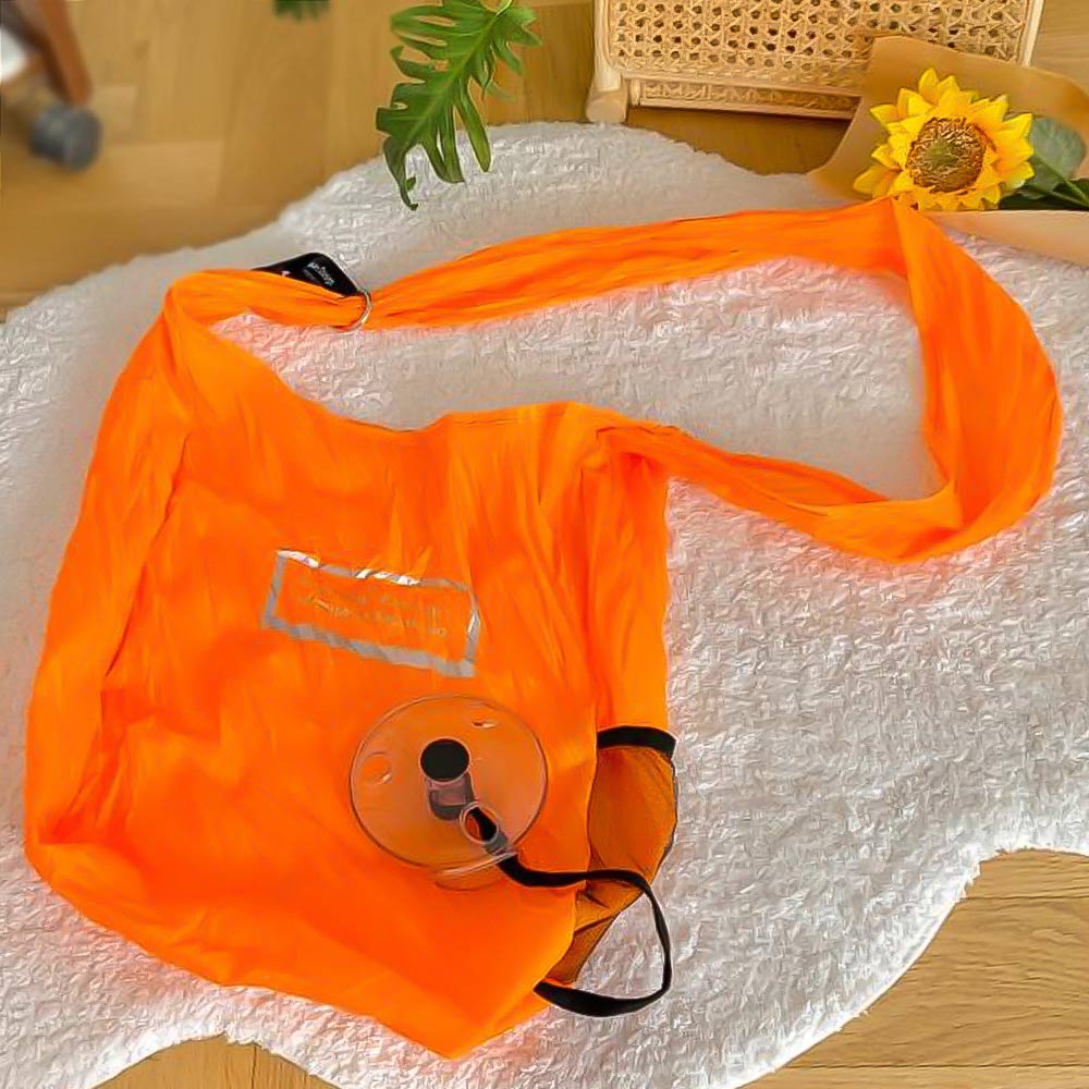 Bolsa ecológica enrollable y reutilizable color naranja para compras